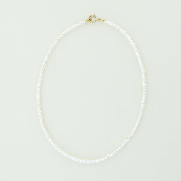 Sailormade women's minimalist fresh water white pearl necklace with 14k gold fill clasp. Handmade in Newburyport, MA.