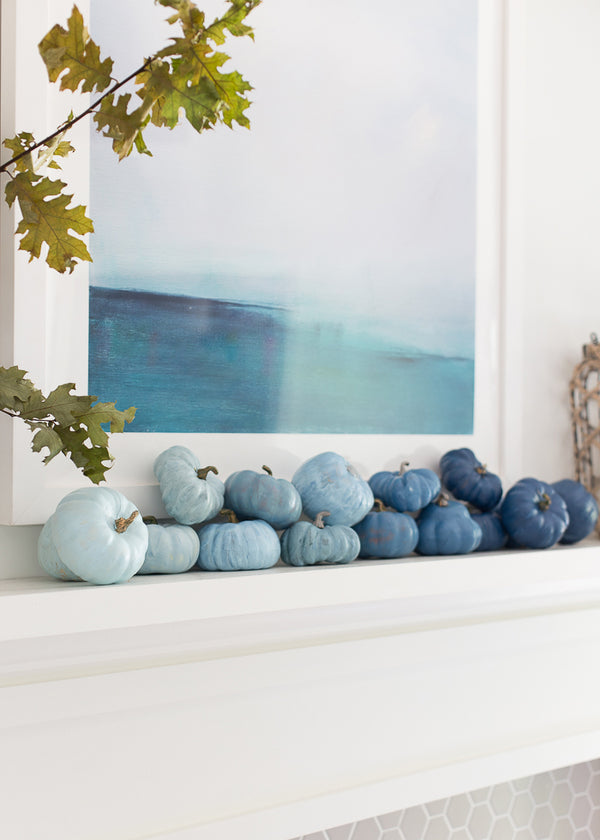 painted pumpkins on mantel in ombre blue