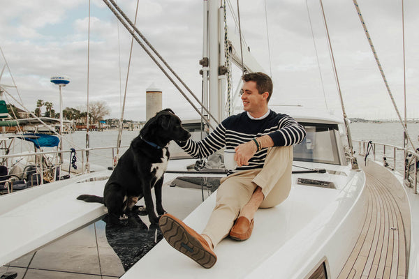 paul landry wearing brooks bothers on a yacht in florida