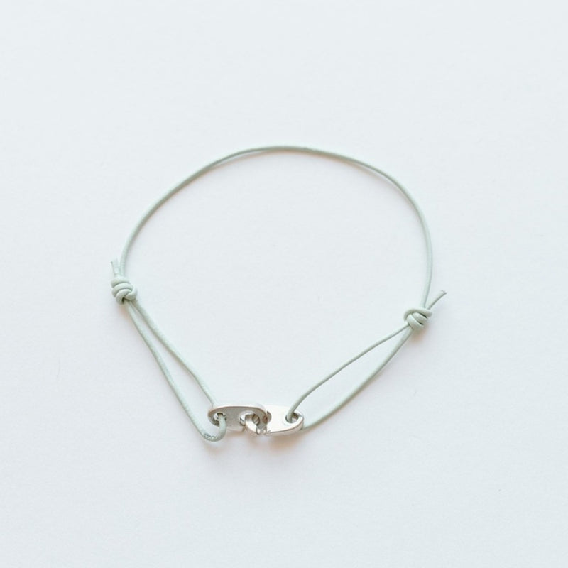 Sailormade women’s nautical leather wrap sterling silver mini brummel bracelet with adjustable slipknots.