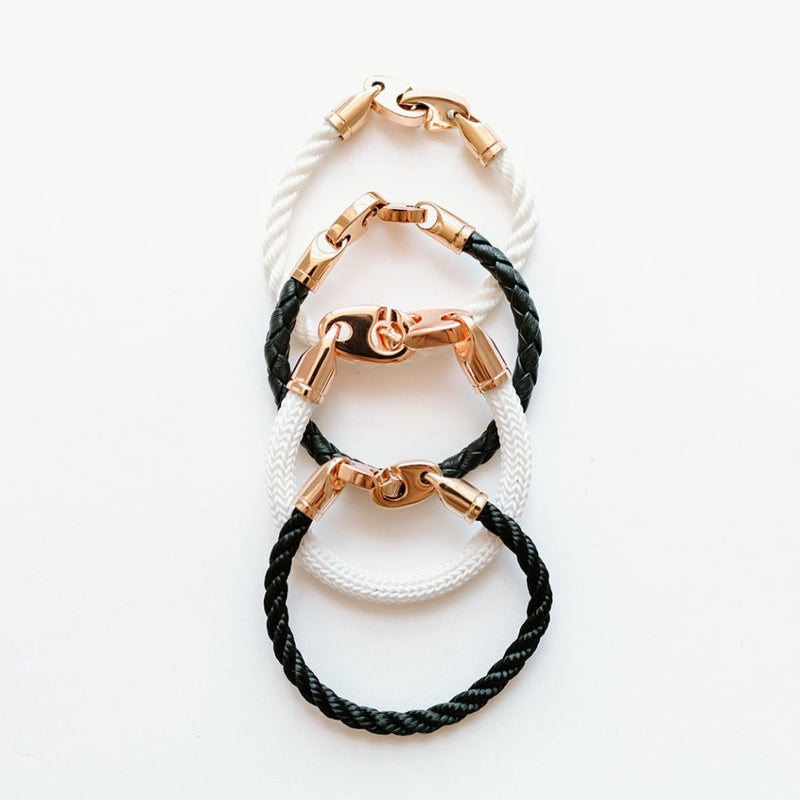 Sailormade women’s nautical single wrap marine rope bracelet with rose gold brummel clasps in white and black with leather wrap and Big Brummel Charter Bracelet. Handmade in Boston, MA.