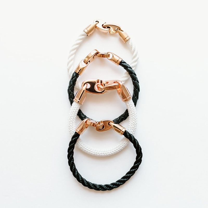 Sailormade women’s nautical single wrap marine rope bracelet with rose gold brummel clasps in white and black with leather wrap and Big Brummel Charter Bracelet. Handmade in Boston, MA. 
