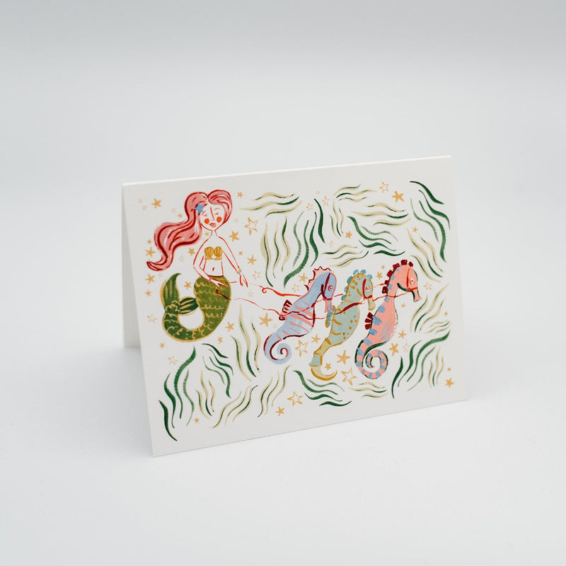 Sailormade x Lexi Mayde Handmade Greeting card of the merry mermaid and her sleigh of seahorses