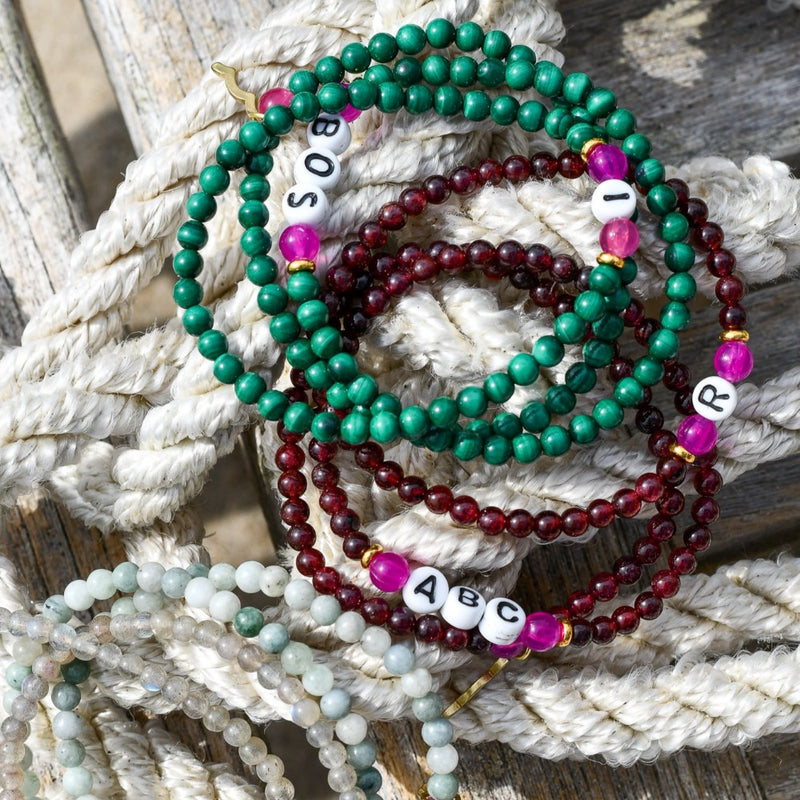 Rayminder UV Awareness Bracelets for sun safety and uv protection in fall colors garnet and malachite, 