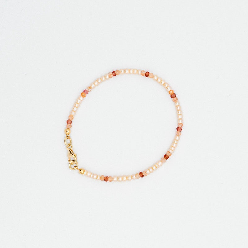 Sailormade women's pink pearl bracelet with sunstone and garnet beads. Made in Boston, MA.