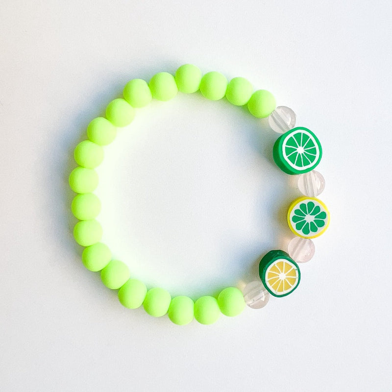 Sailormade kid's rayminder uv awareness bracelet for sun safety education with citrus beads in green. Handmade locally in Boston.