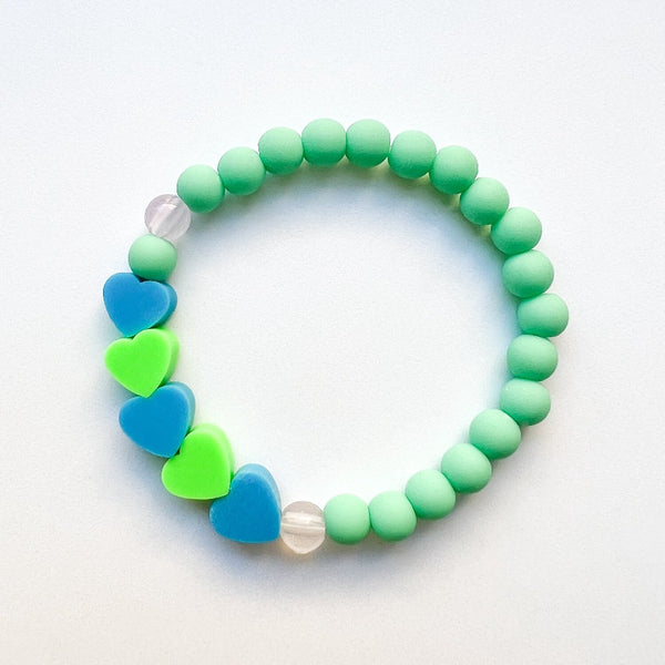 Sailormade kid's rayminder uv awareness bracelet for sun safety education with heart beads in green and blue. Handmade locally in Boston.