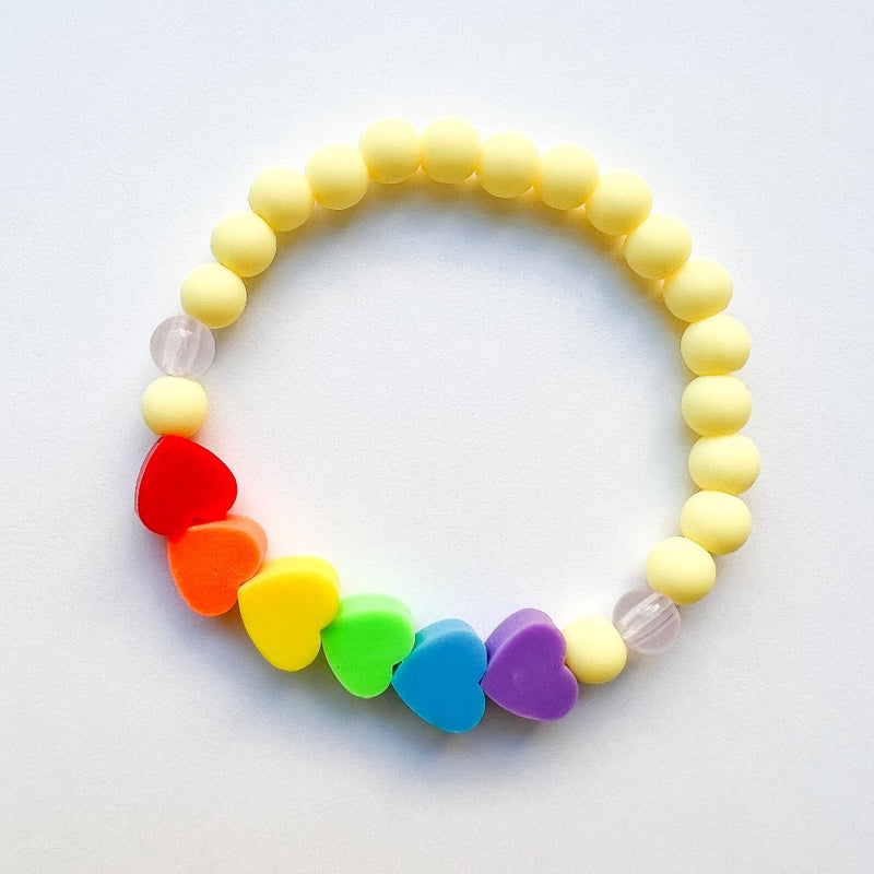 Sailormade kid's rayminder uv awareness bracelet for sun safety education with rainbow heart beads in yellow. Handmade locally in Boston.