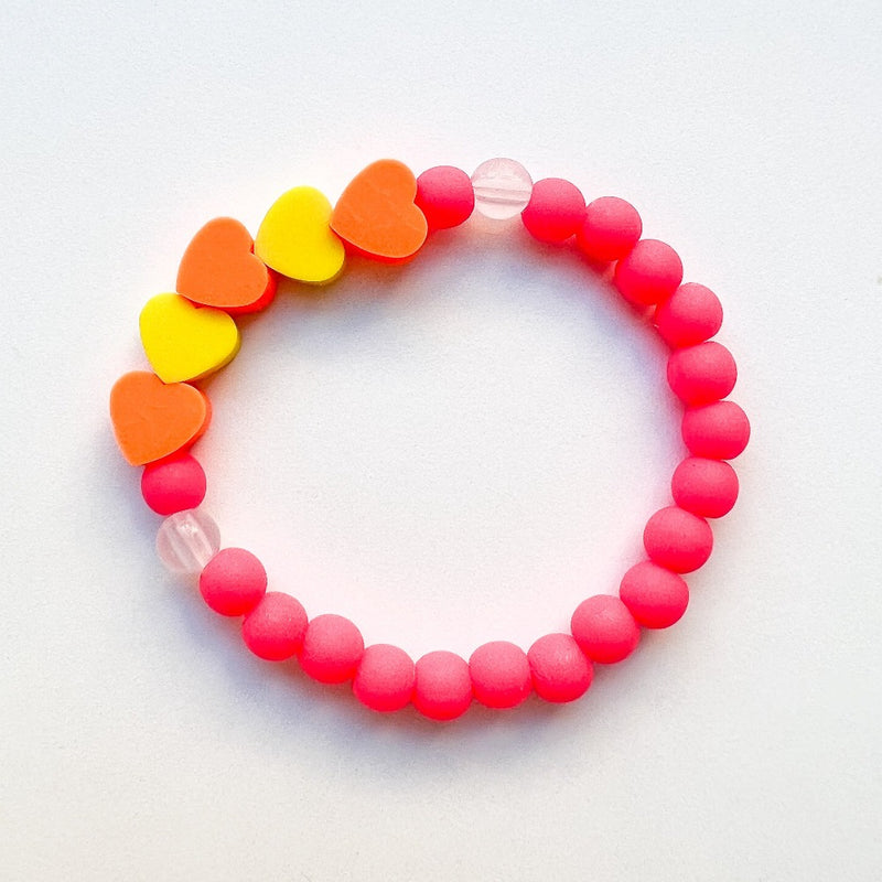 Sailormade kid's rayminder uv awareness bracelet for sun safety education with heart beads in hot pink, orange and yellow. Handmade locally in Boston.