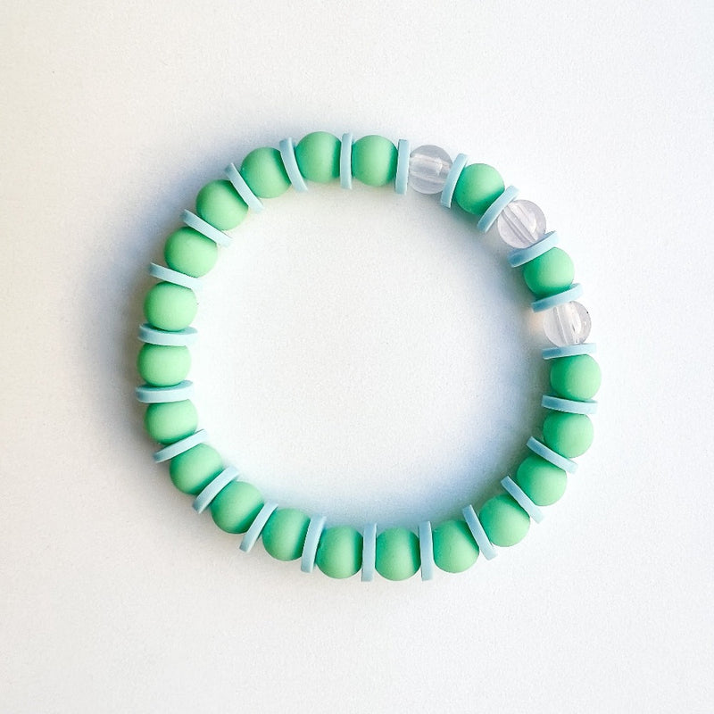 Sailormade kid's rayminder uv awareness bracelet for sun safety education with green and blue beads. Handmade locally in Boston.