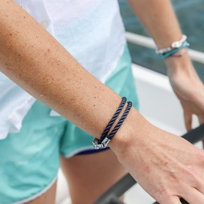 Women's jewelry made for boaters and sailors in Boston. Sporty nautical style wearing the endeavour double wrap rope bracelet in navy with stainless steel brummel clasp.