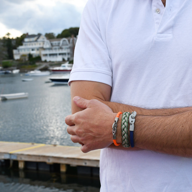 men's nautical bracelet stack with catch single rope bracelet in orange, league magnetic braided bracelet in green, and big brummel bracelet with italian braided cord in blue