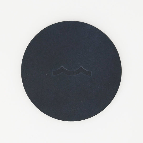 Sailormade nautical leather coasters with wave motif in midnight navy. Made in Massachusetts with USA leather.