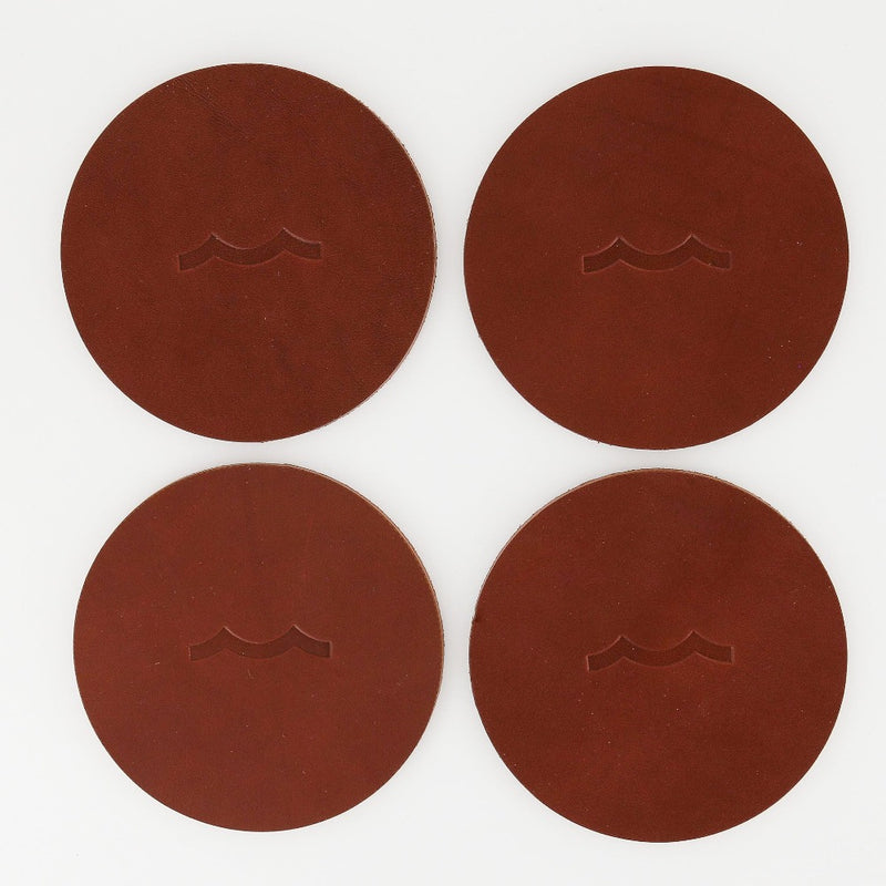 Sailormade nautical leather coasters with wave motif in chestnut brown. Made in Massachusetts with USA leather.