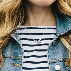 Preppy woman wearing sailor stripes and Sailormade nautical double brummel necklace in sterling silver. Rockport, MA.
