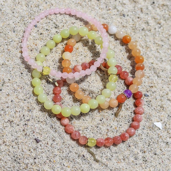 Sailormade rayminder uv awareness bracelets for sun safety. Rose quartz, lemon jade, topaz jade, sunstone. Made in Boston, MA. 